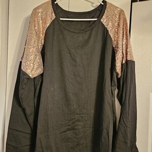 Great lightweight black sweater with rose gold sequins shoulders.